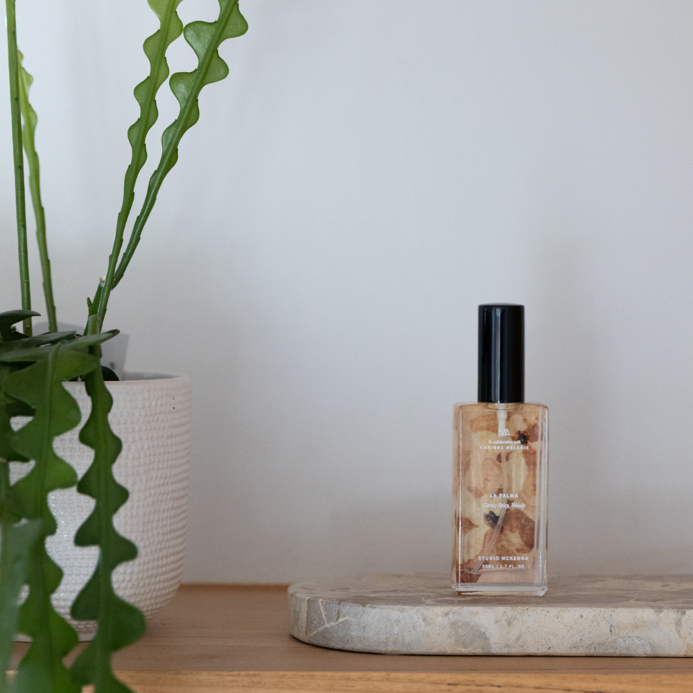 Close-up of La Palma Interior Spray bottle showing dreamy pink and starlit artwork by Corinne Melanie