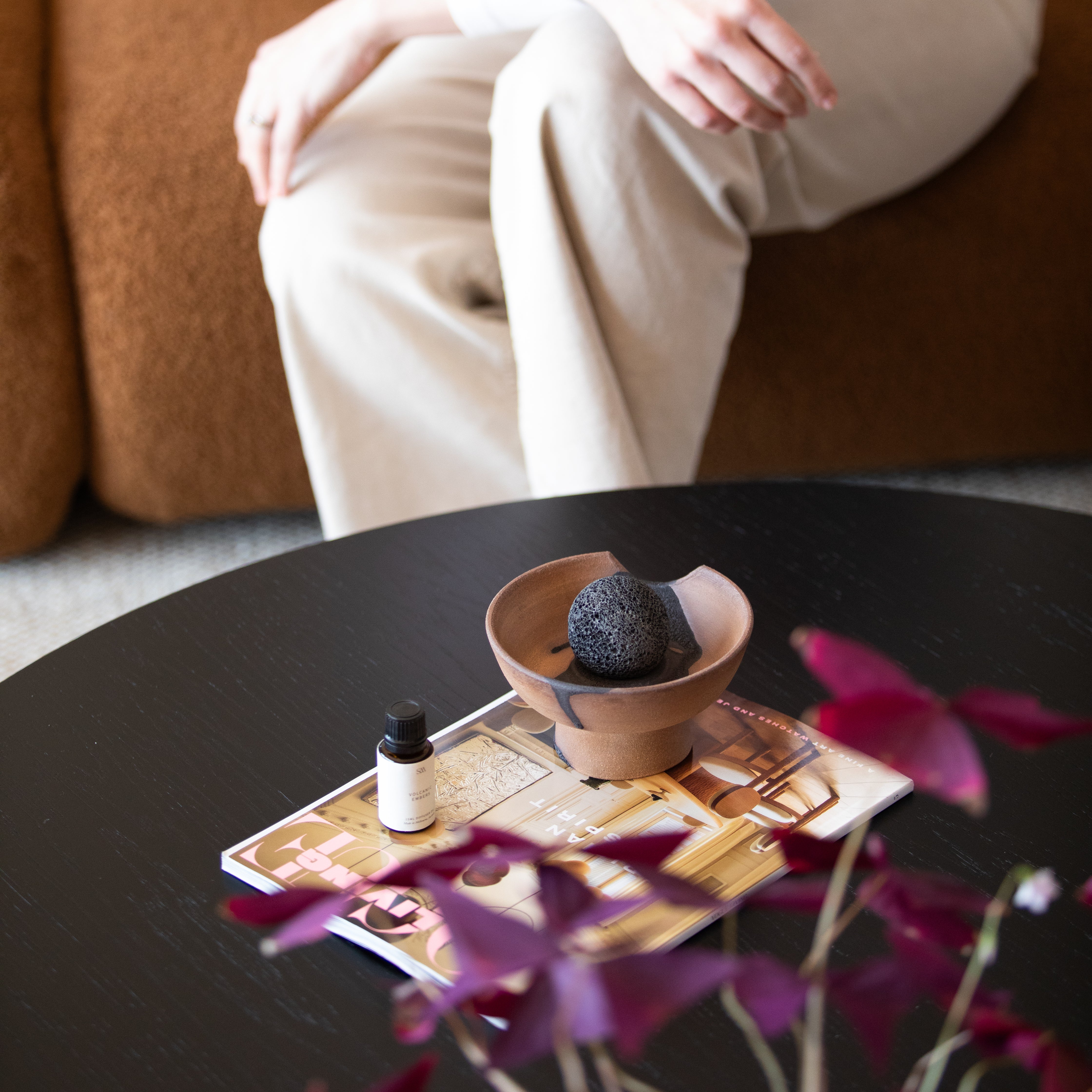 Detail shot of volcanic rock sphere and ceramic tray from the Mediterranean Fig Lahar Diffuser