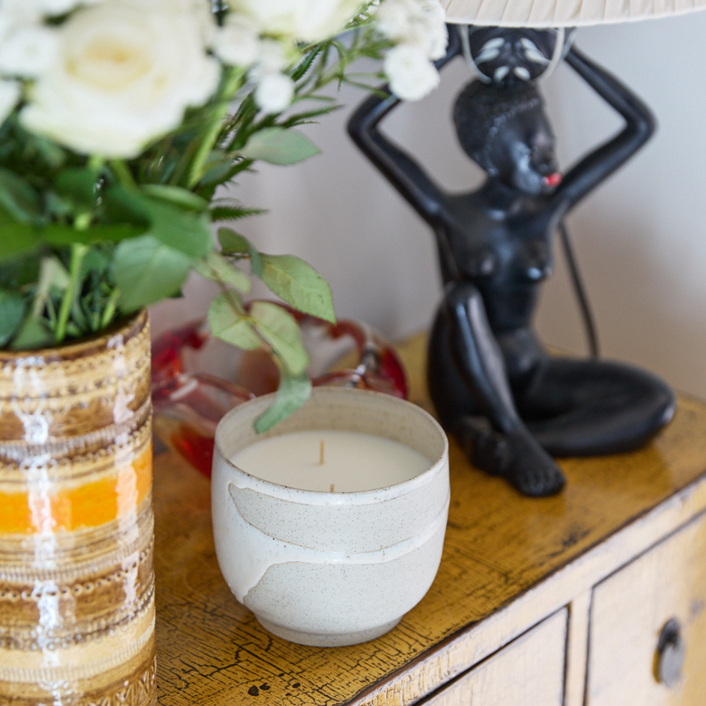 Lunara Candle by Studio McKenna — styled with florals and vintage decor for an elevated interior setting
