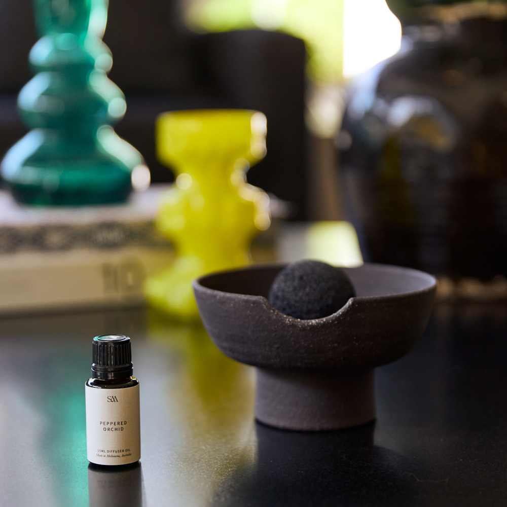 Detail shot of black ceramic tray showing handcrafted texture