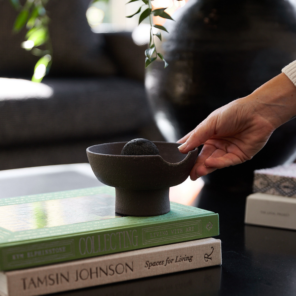 Close-up of Studio McKenna Peppered Orchid Obsidian Diffuser showing volcanic rock and ceramic tray detail