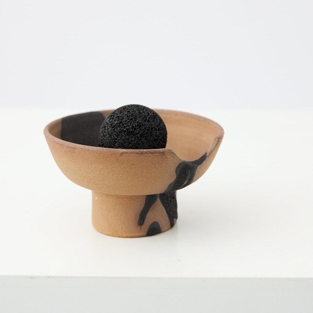 Close-up of Studio McKenna Red Santal Lahar Diffuser showing volcanic rock and ceramic tray detail