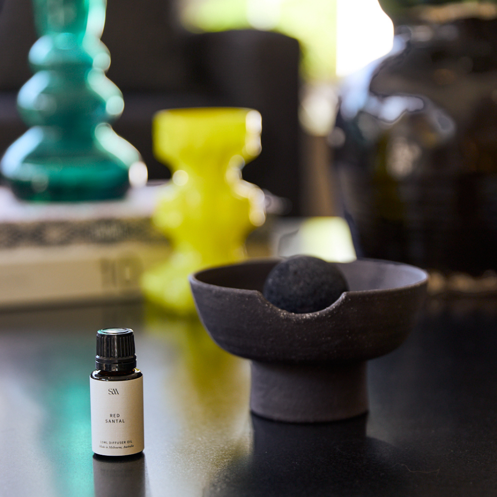 Red Santal Obsidian Diffuser styled on wooden shelf with minimal décor