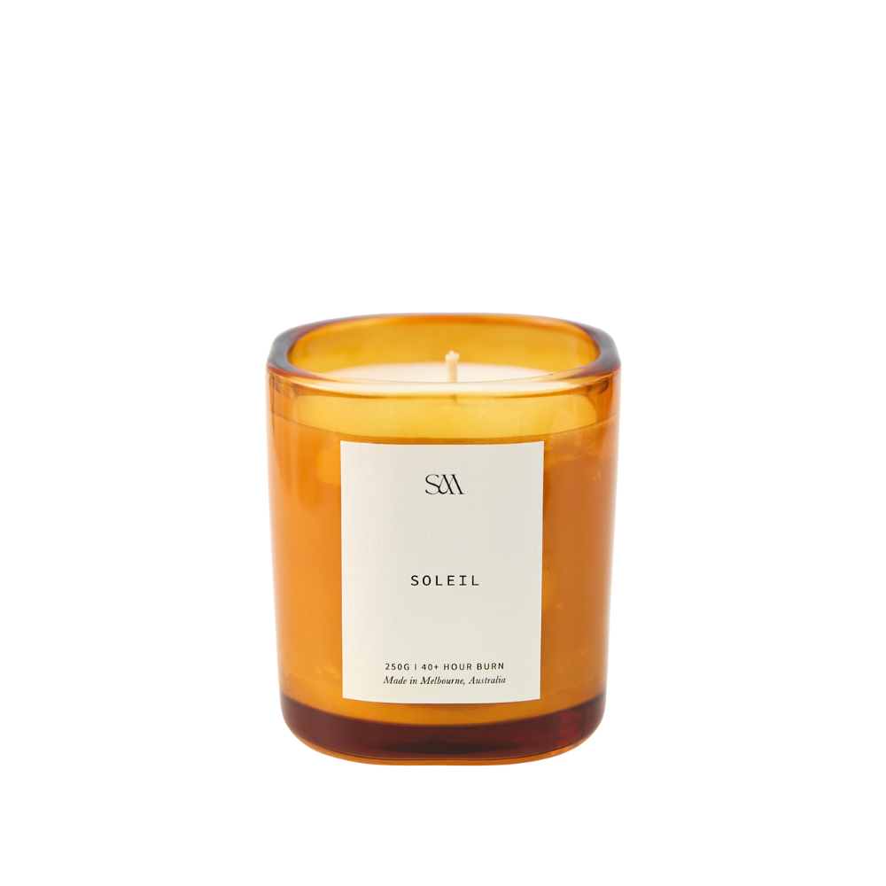 Close-up of Soleil Signature Candle showing creamy wax and elegant vessel
