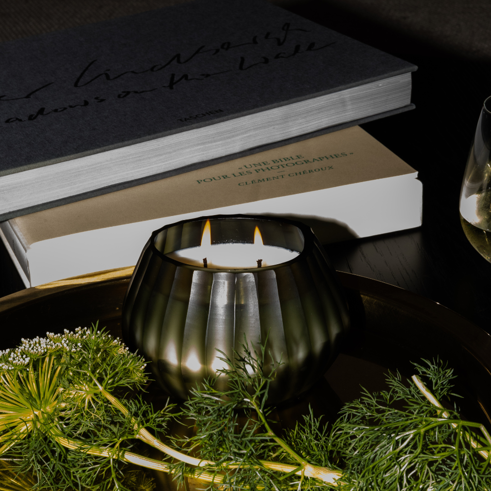 Close-up of The Foundry Aura Moss Candle showing linear carving and etched glass detail