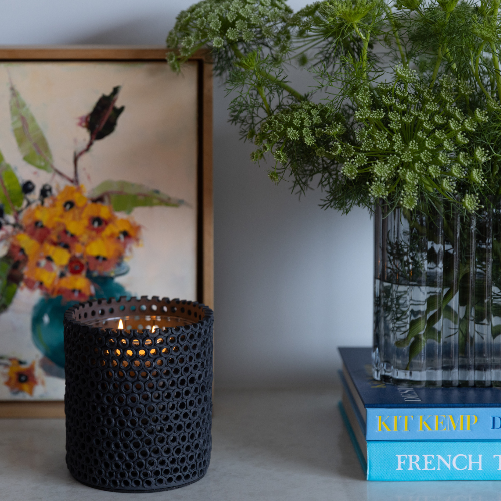 Coralite Ebony Candle styled in a minimalist interior, showcasing hand-finished ceramic surface