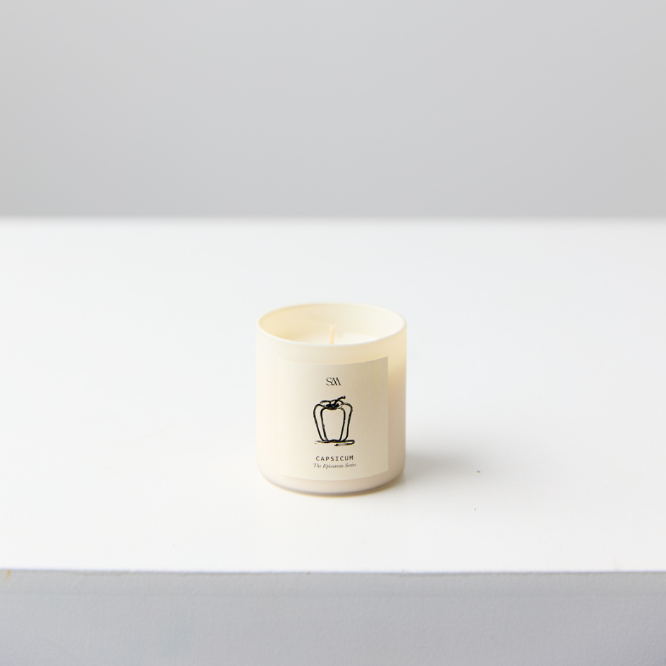 Close-up of Studio McKenna Capsicum Candle from Epicurean Series