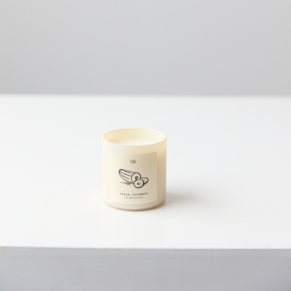 Close-up of Fresh Cucumber Candle label with light green wax tones