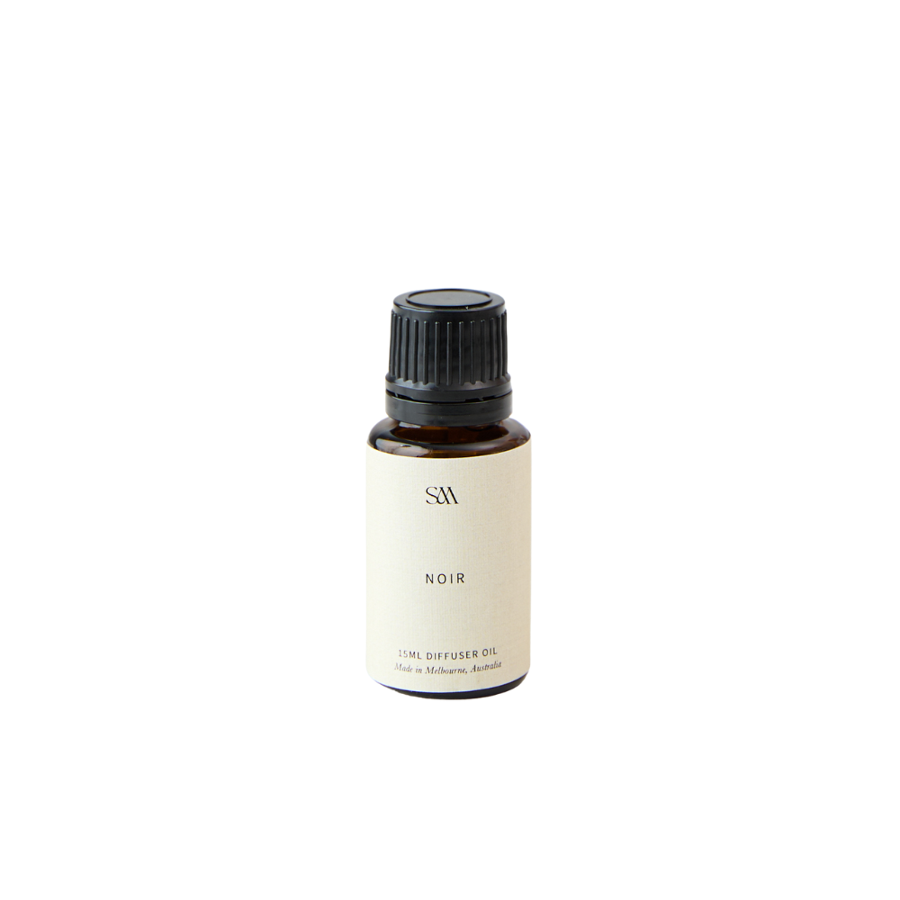 Studio McKenna Noir Fragrance Oil in amber glass bottle with minimalist label