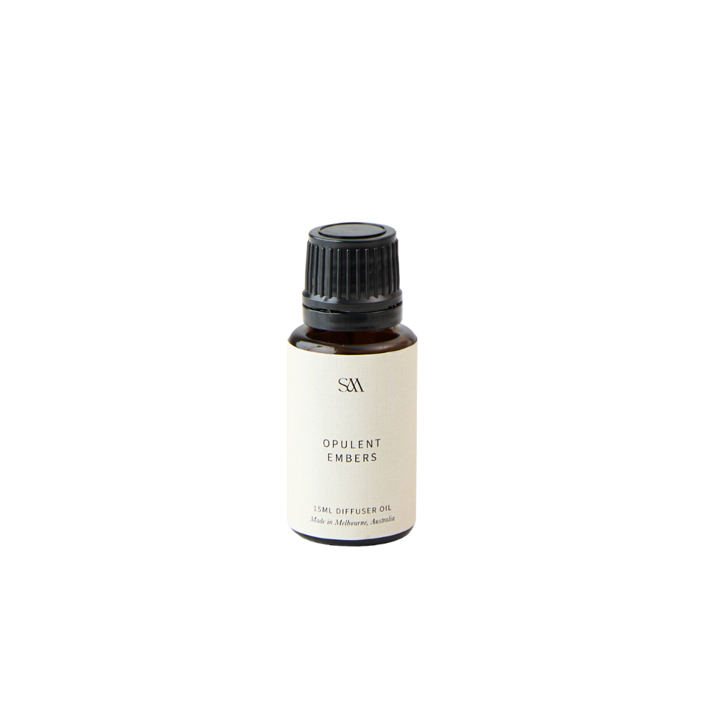 Studio McKenna Opulent Embers Fragrance Oil in amber glass bottle with minimalist label