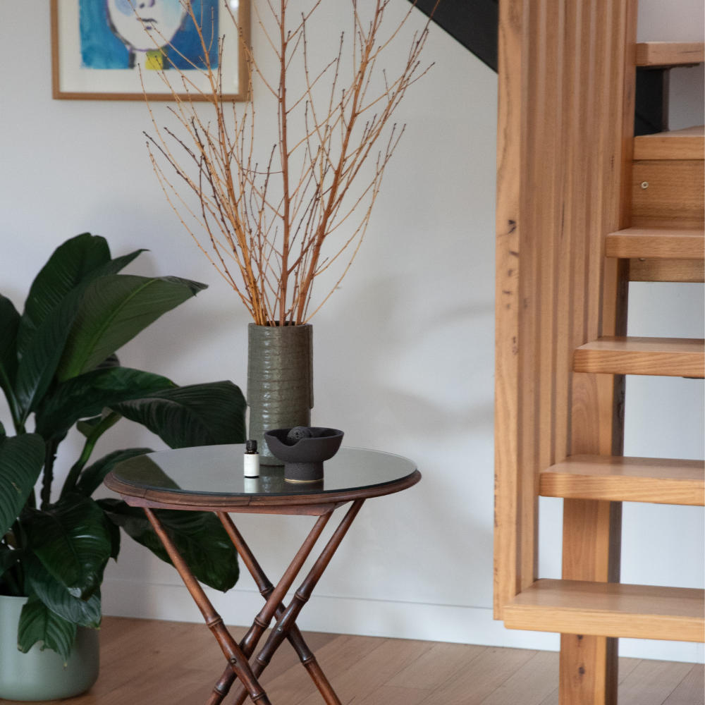 Studio McKenna Red Santal Obsidian Diffuser styled in a contemporary home interior with warm, tonal décor