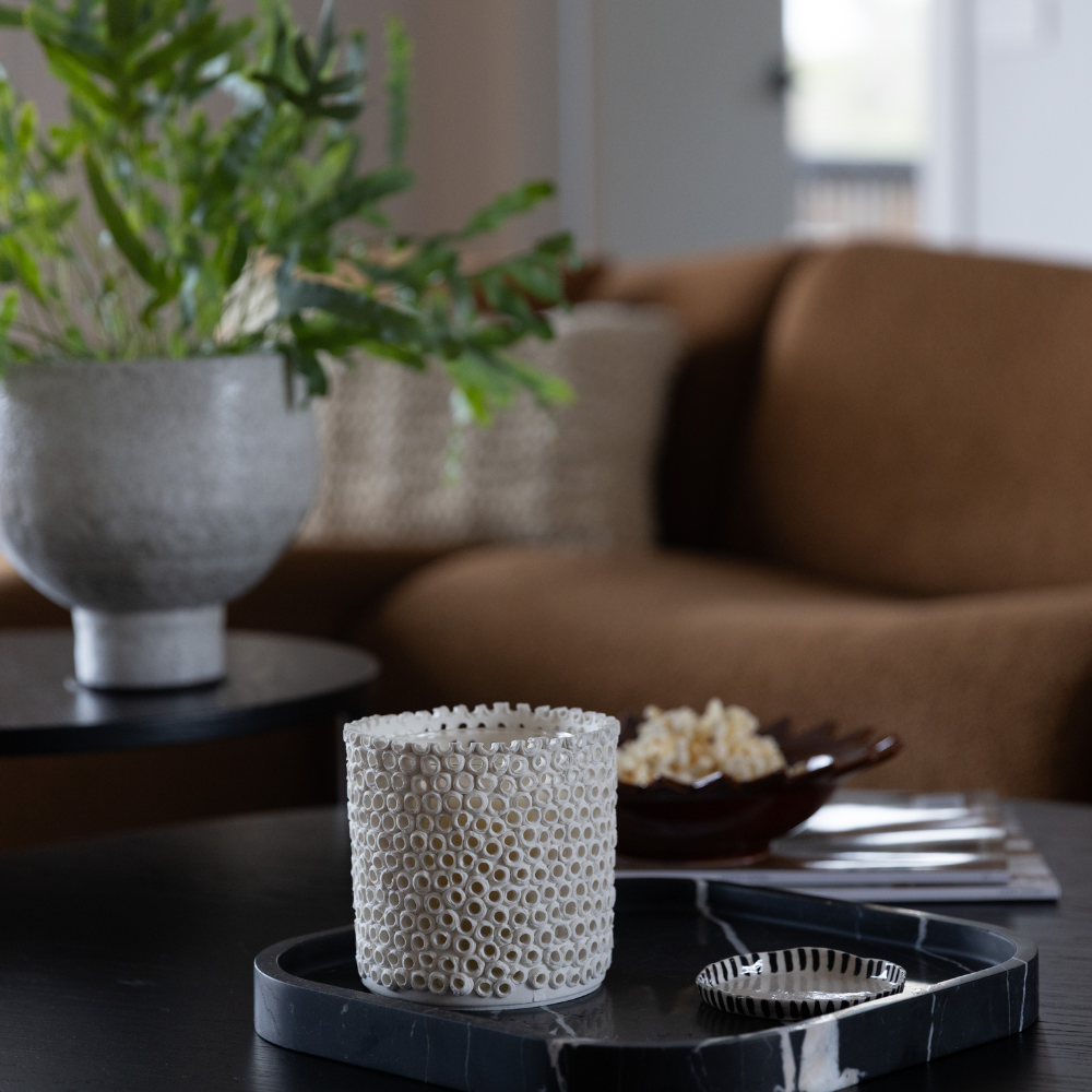 Close-up of The Foundry Coralite Ivory Candle showing coral-inspired ceramic detail and artisanal finish
