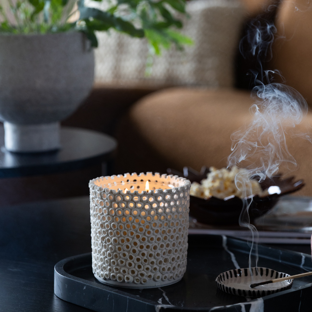 Coralite Ivory Candle styled in a coastal-inspired interior, showcasing hand-finished ceramic texture